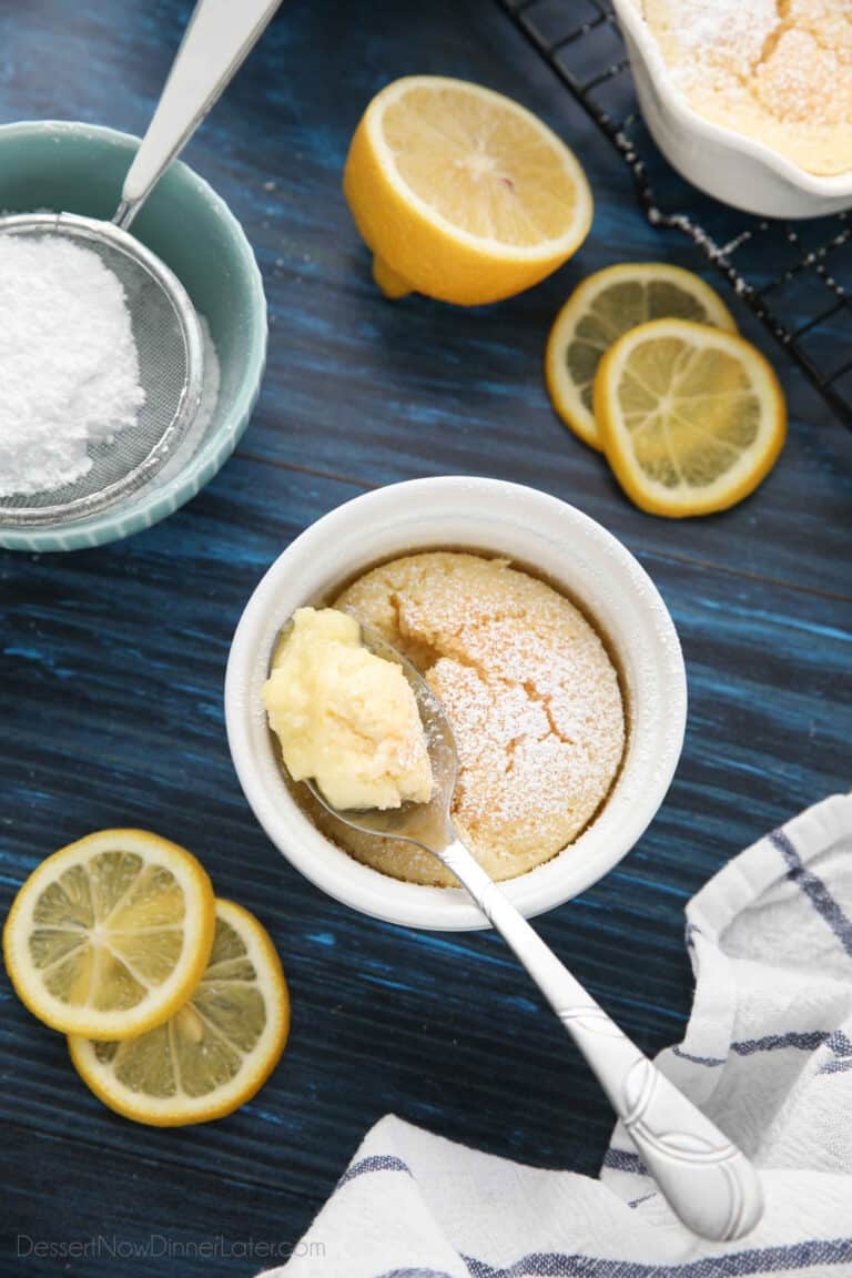 Spoonful of lemon pudding cake in ramekin.