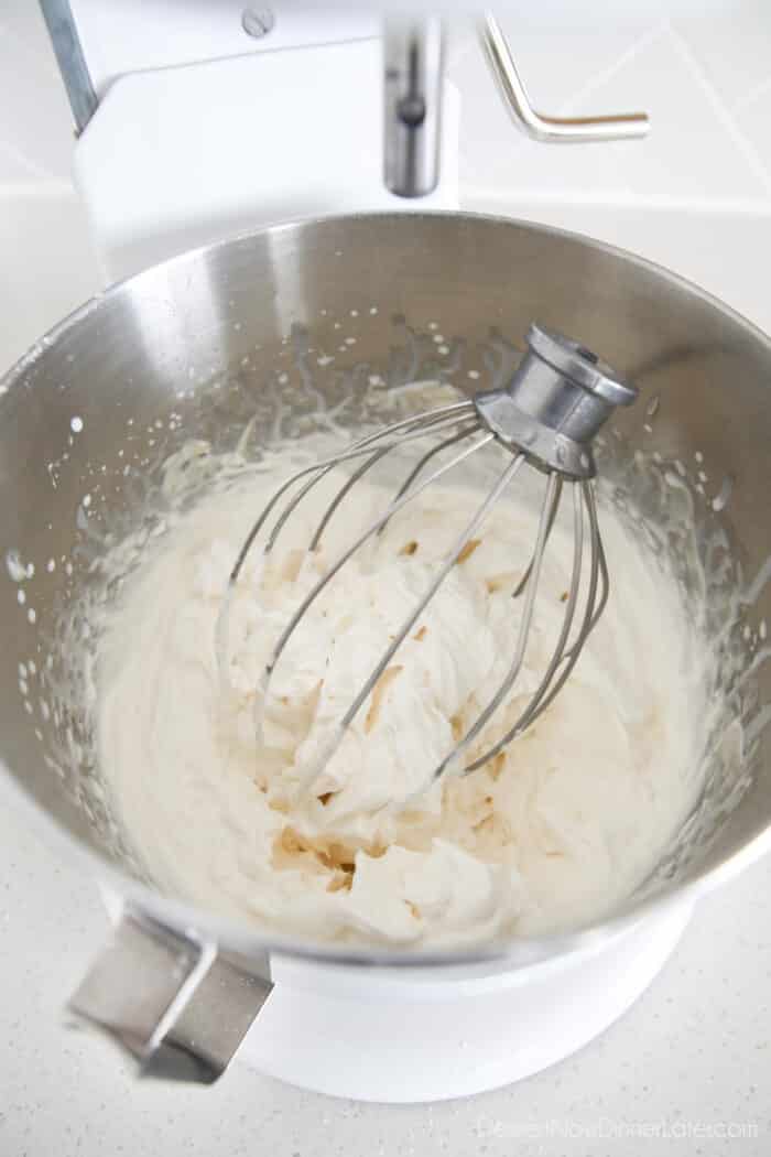 Whisk full of whipped cream cheese frosting in the mixing bowl.