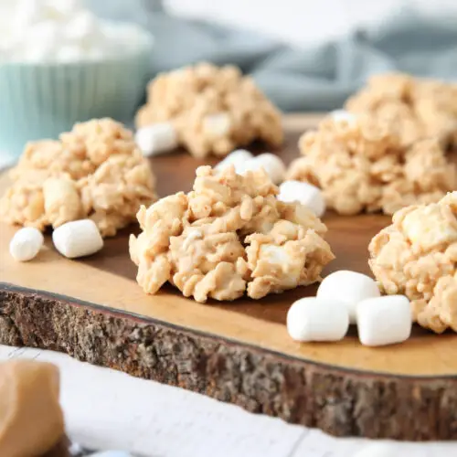 Close up of no-bake rice krispie treat cookies made with white chocolate, peanut butter, and marshmallows.