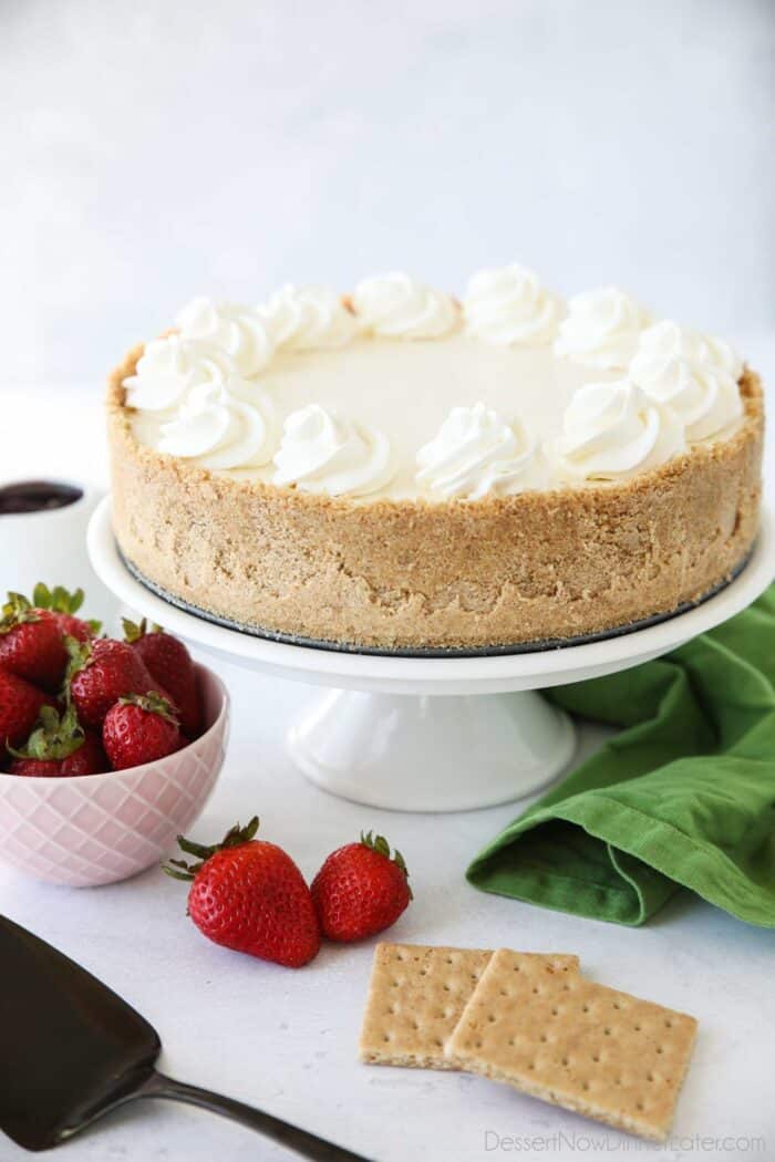 Whole no bake cheesecake on platter.