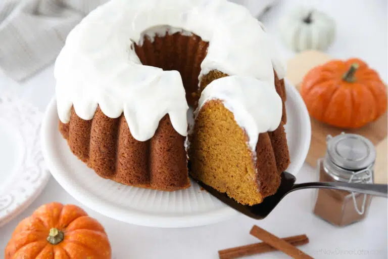 Top view of a slice of pumpkin bundt cake being removed with a cake server.