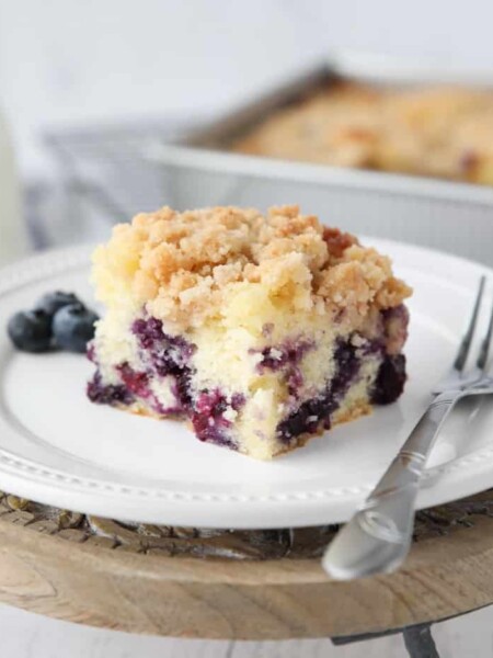 Slice of blueberry streusel coffee cake on a plate.