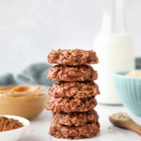 Easy no bake cookies made with peanut butter and chocolate stacked high.