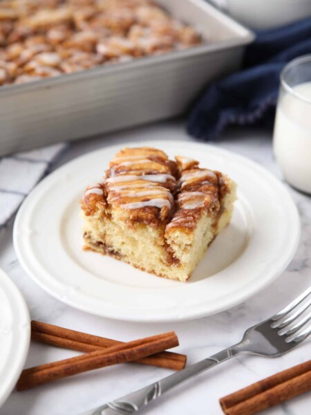 A fluffy vanilla cake filled with cinnamon swirls just like a cinnamon roll.