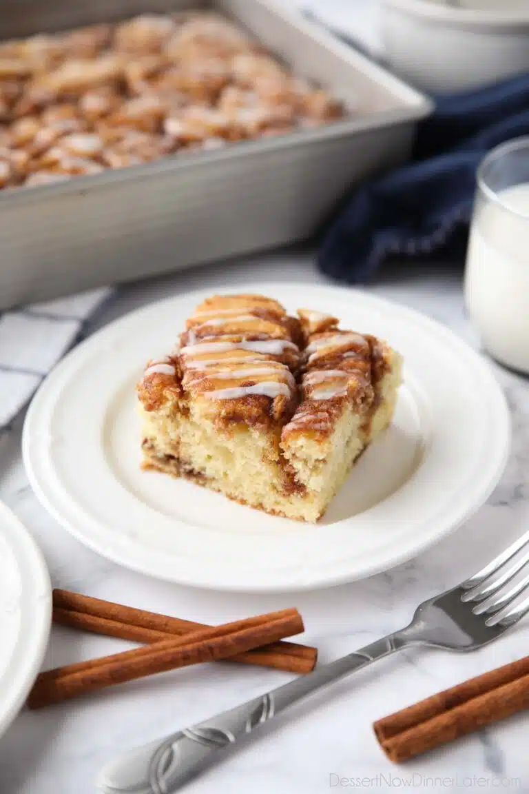 A fluffy vanilla cake filled with cinnamon swirls just like a cinnamon roll.