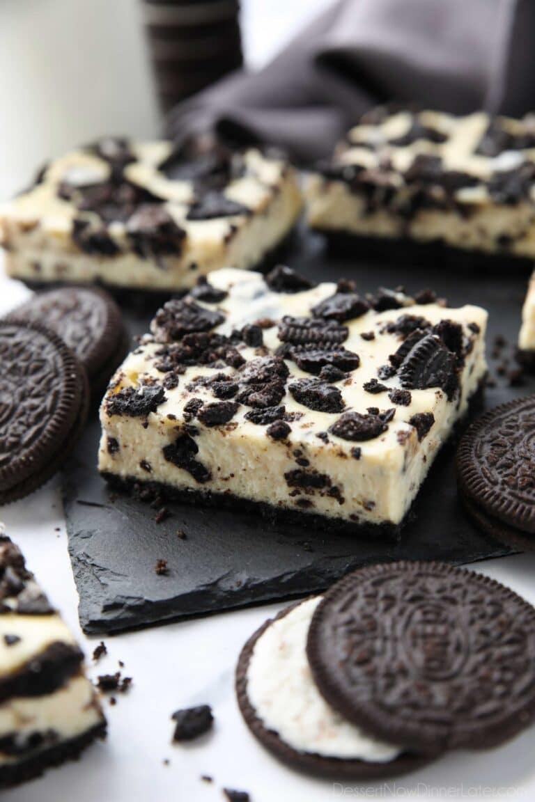 Close up of Oreo cheesecake bars with more Oreos.