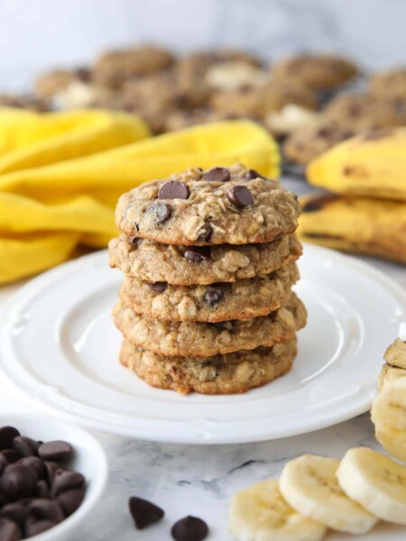 Stack of banana oatmeal chocolate chip cookies on a plate.