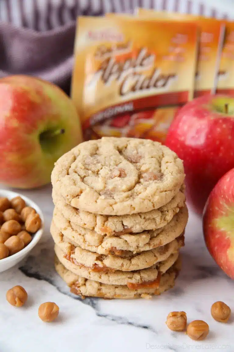 Stack of caramel apple cider cookies made with apple cider mix and caramel bits.