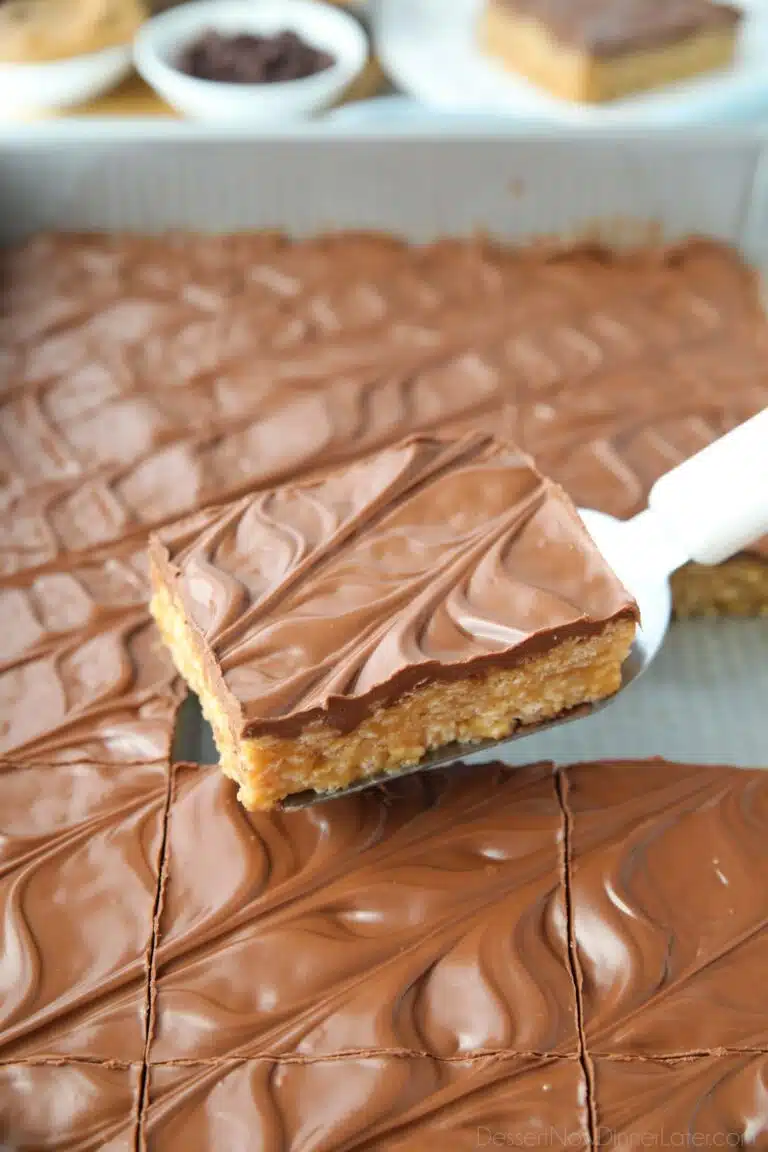 Scooping no bake scotcharoos (aka peanut butter rice krispie treats) out of the pan.