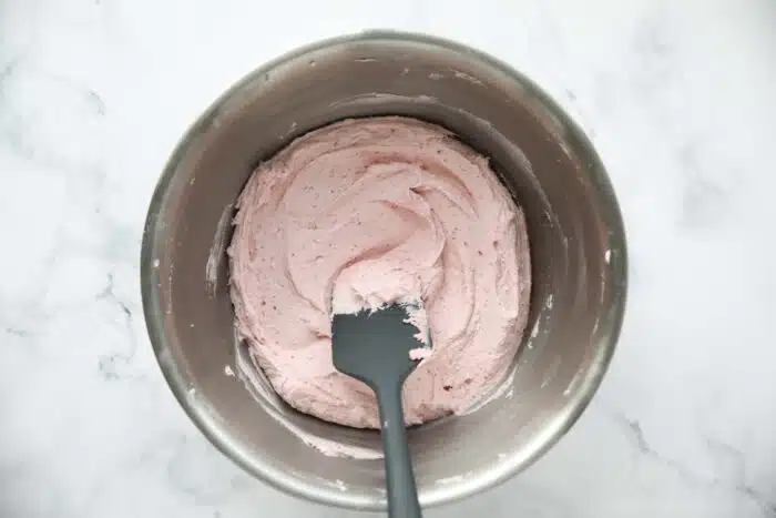 Strawberry frosting made with freeze dried strawberries.