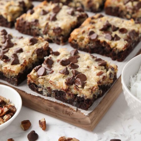 Close up of German Chocolate Bars showing the brownie crust, coconut pecan topping, and chocolate chips.