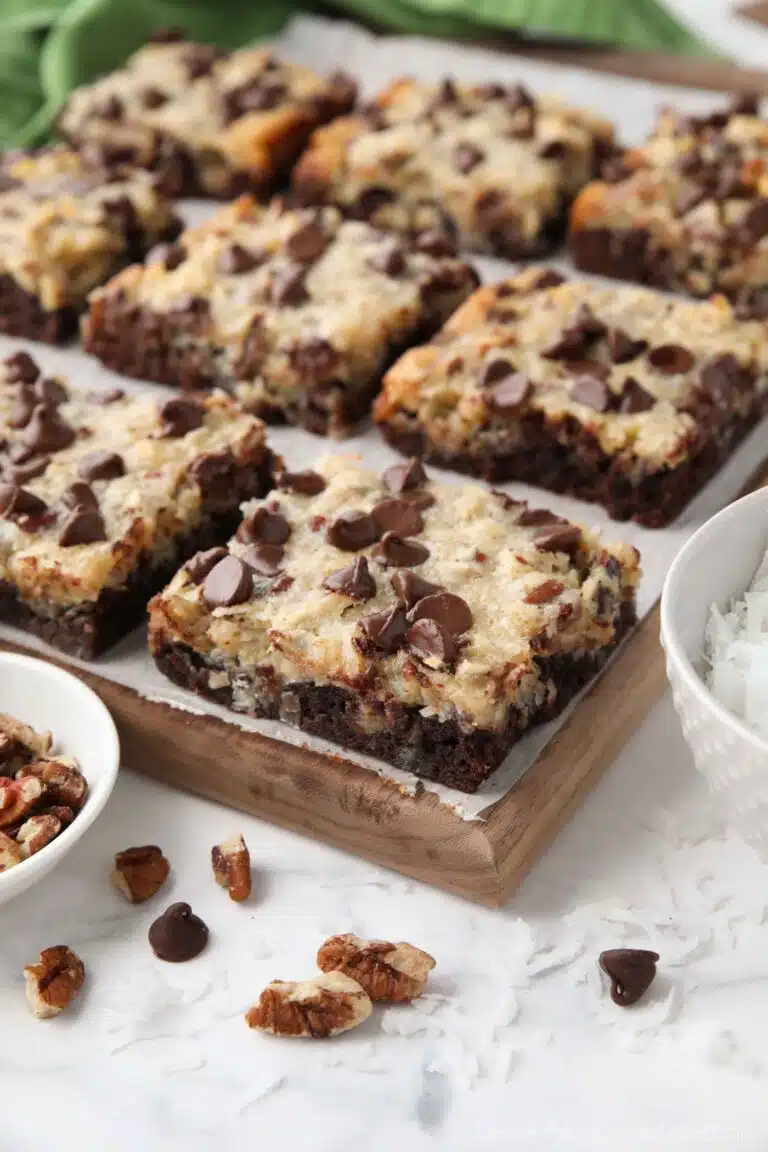 Close up of German Chocolate Bars showing the brownie crust, coconut pecan topping, and chocolate chips.