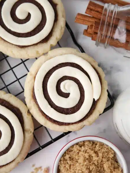 Close-up top view of Cinnamon Roll Cookies on a wire cooling rack.