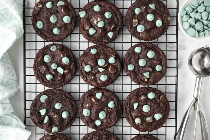 Fudgy chocolate mint chip cookies on a wire cooling rack.