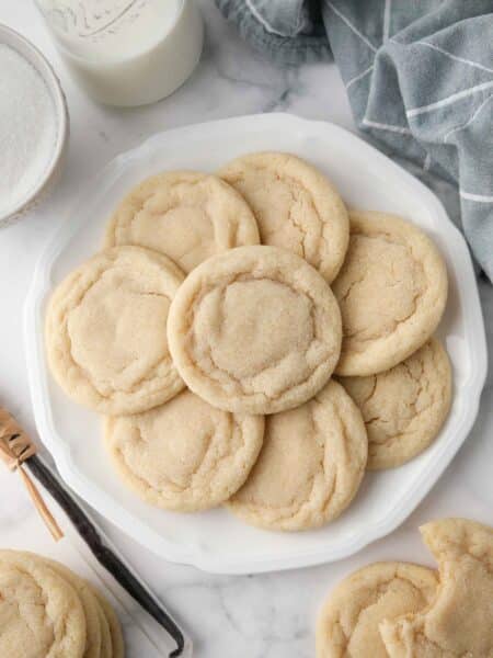 Easy Sugar Cookies on a plate. Chewy outside and soft inside.