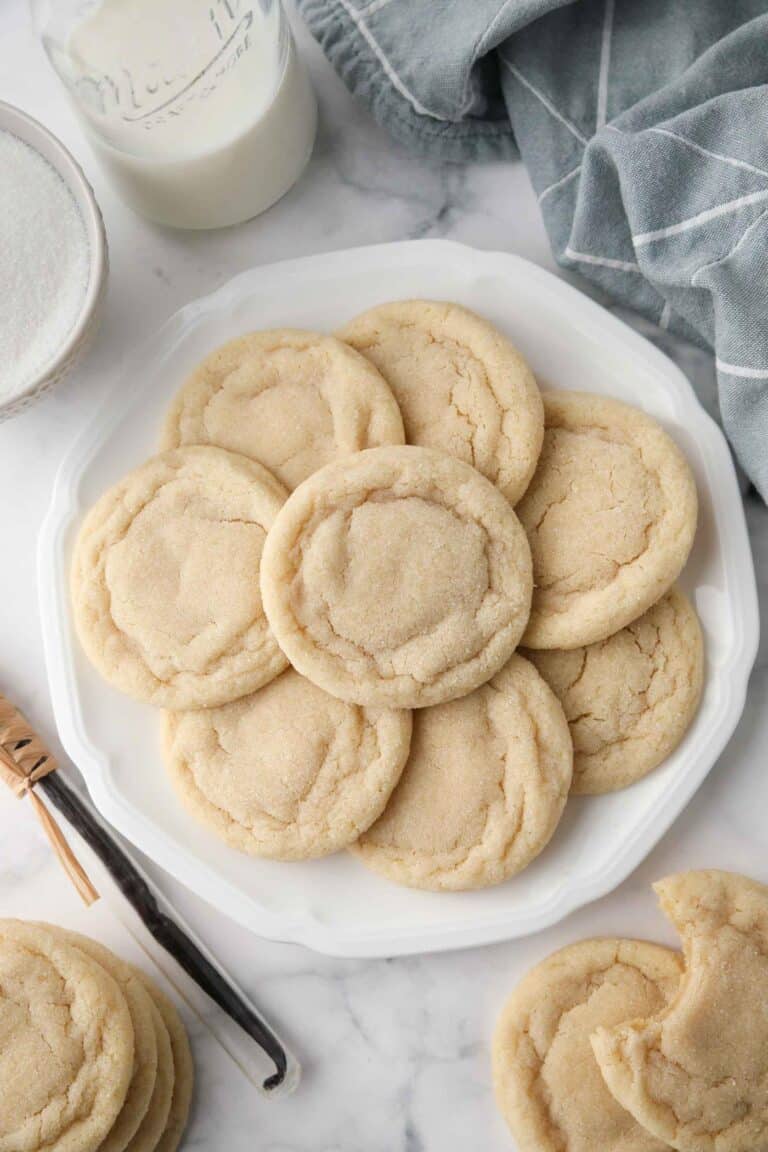 Easy Sugar Cookies on a plate. Chewy outside and soft inside.