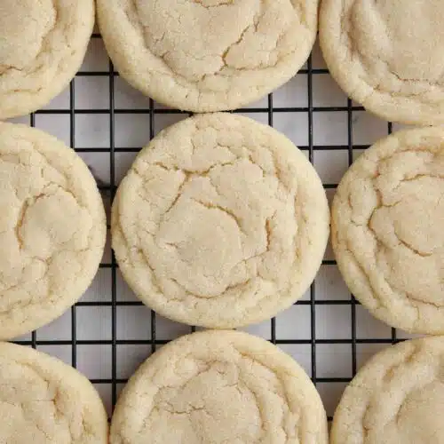 Easy sugar cookies without frosting cooling on a wire rack.