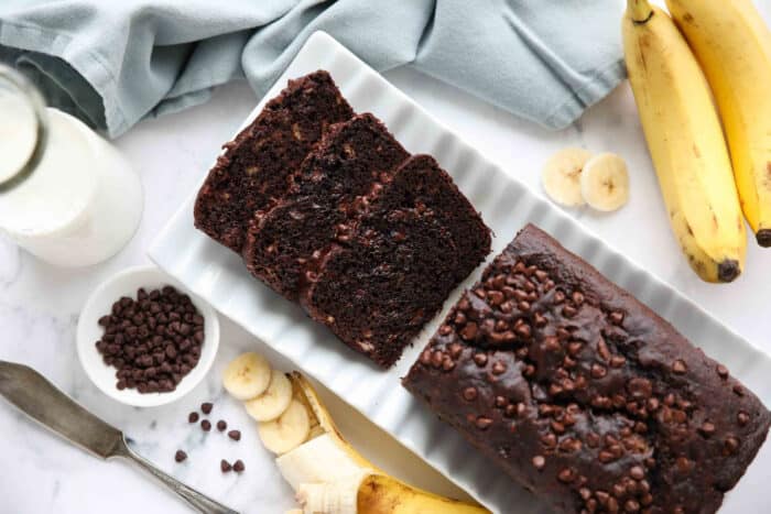 Top view of slices of chocolate banana bread with chocolate chips inside and on top.