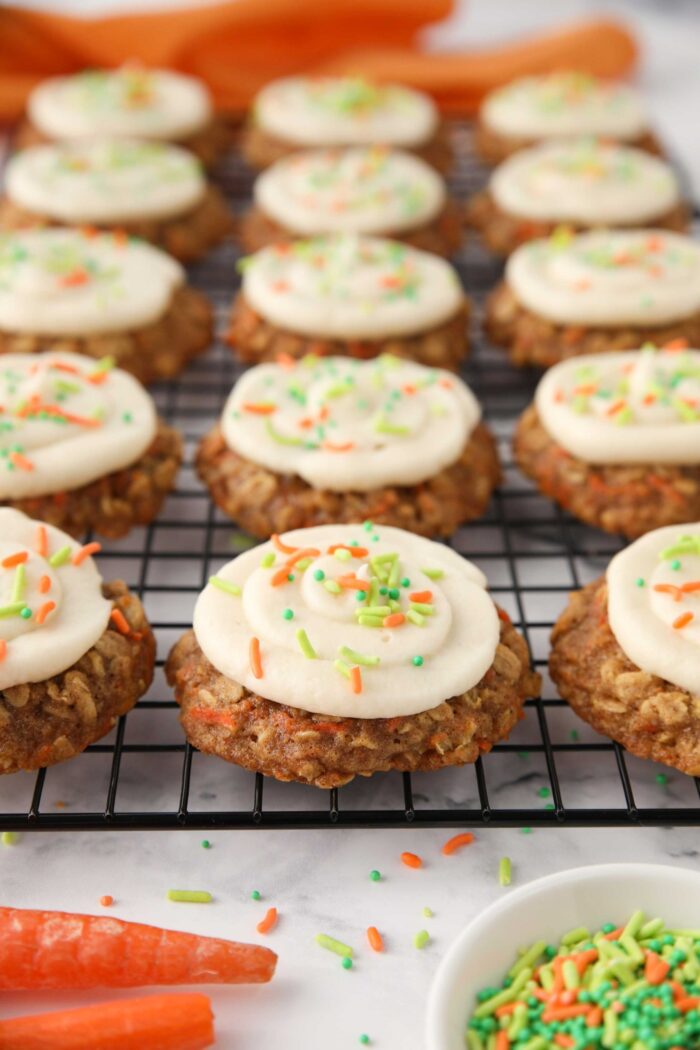 Oatmeal carrot cake cookies with cream cheese frosting and sprinkles.