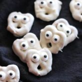 Ghost Pretzels - White chocolate dipped pretzels are made into ghosts with candy eyes and a little bit of imagination.